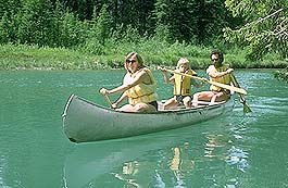 While camping at Bow Valley Park Campgrounds you can go Canoeing with the family